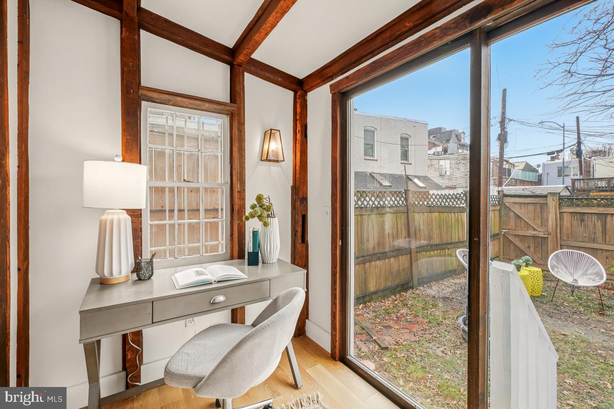 505 9th Street Southeast Washington, DC 20003 - Photo 15 of 30 a room with a large window and a table chair