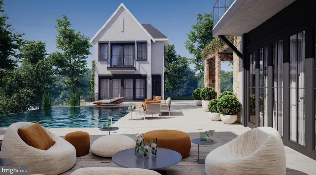 a view of swimming pool with outdoor seating and plants