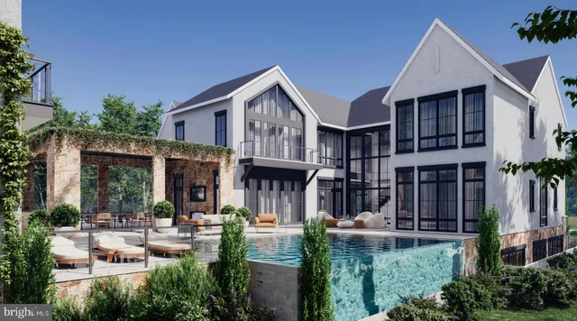 a view of a house with sitting area and garden