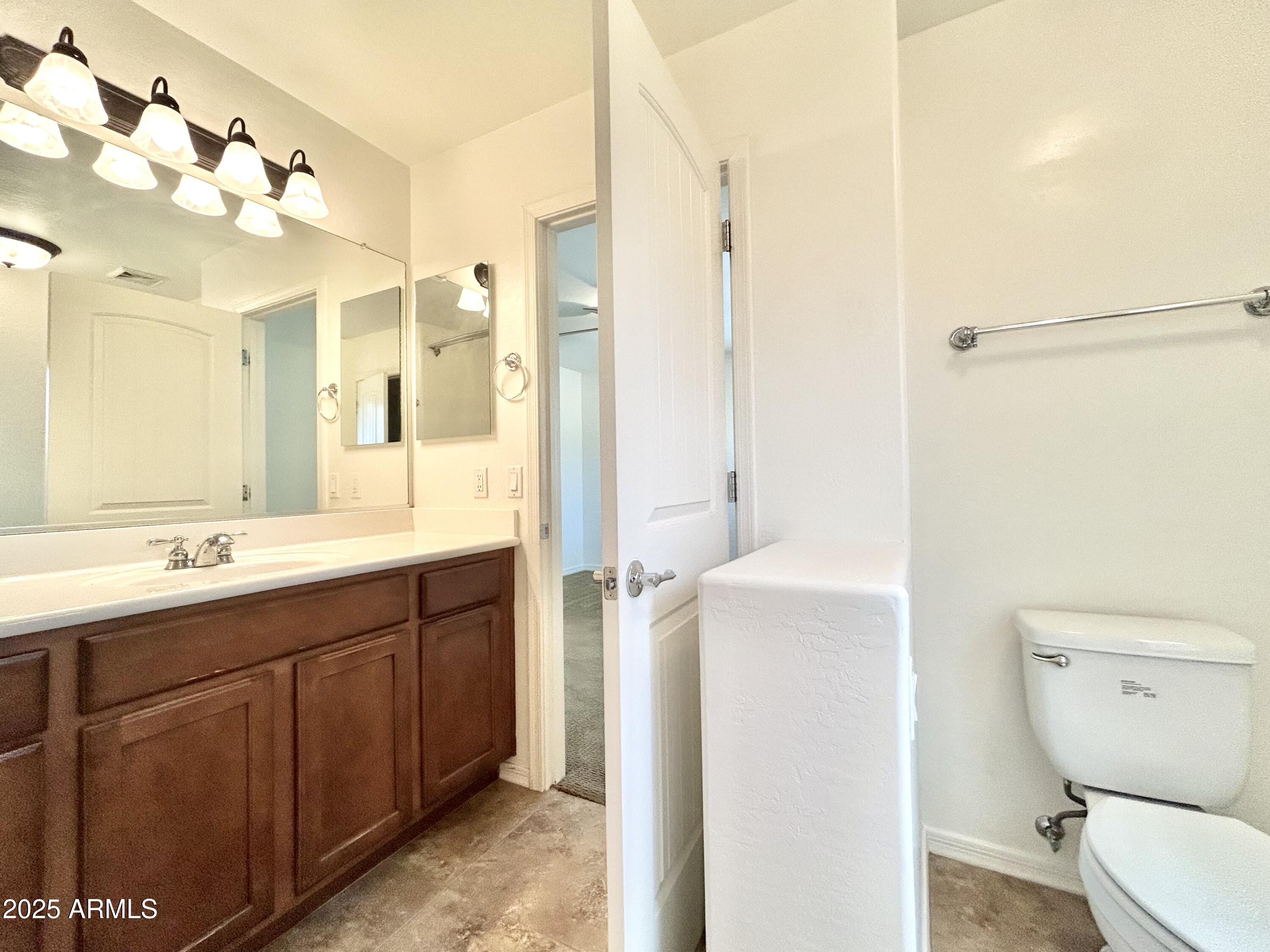 1418 South Jessica Lane Tempe, AZ 85281 - Photo 12 of 13 a bathroom with a sink a toilet and shower
