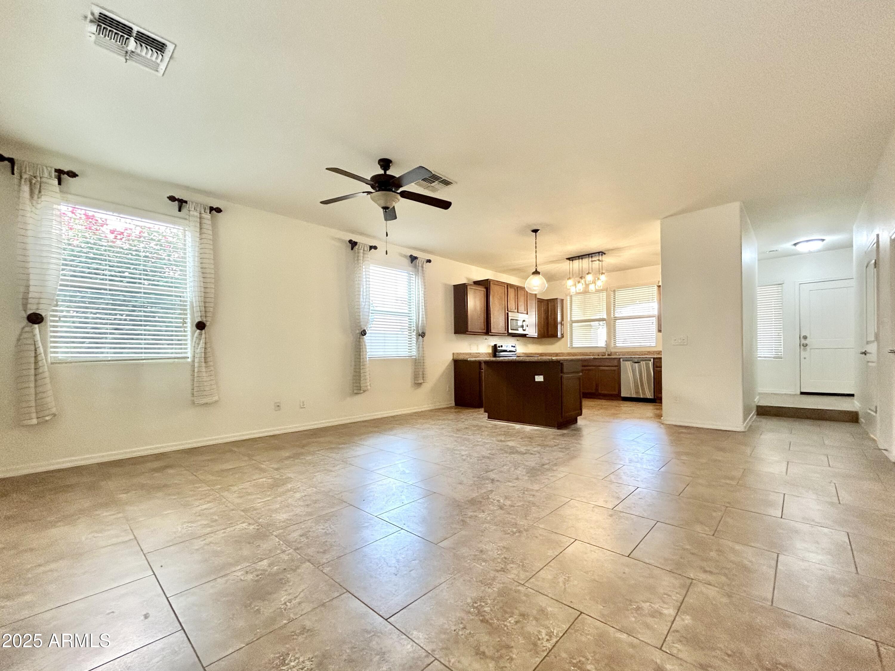 1418 South Jessica Lane Tempe, AZ 85281 - Photo 3 of 13 a large kitchen with cabinets and a kitchen
