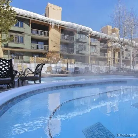 a view of a building with sitting area