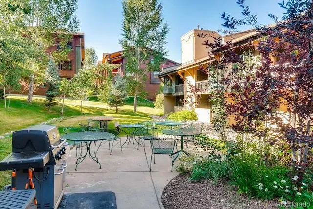 a view of a chairs and table in patio
