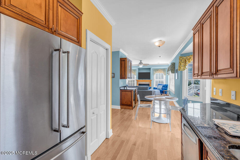 419 Central Avenue Spring Lake, NJ 07762 - Photo 13 of 41 a living room with stainless steel appliances furniture a rug and a kitchen view
