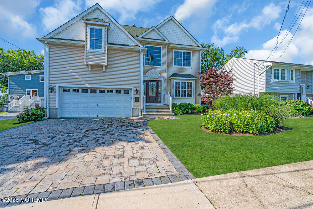 419 Central Avenue Spring Lake, NJ 07762 - Photo 2 of 41 a front view of a house with a garden
