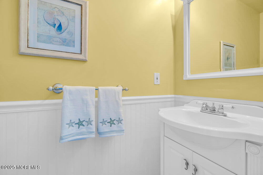 419 Central Avenue Spring Lake, NJ 07762 - Photo 23 of 41 a bathroom with a sink and a mirror