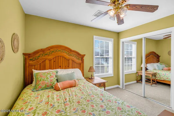 a bedroom with furniture and a window