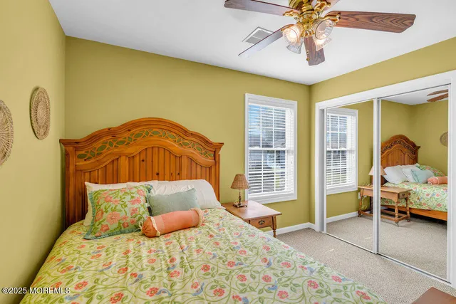 a bedroom with furniture and a window