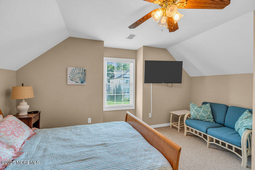 419 Central Avenue Spring Lake, NJ 07762 - Photo 28 of 41 a living room with furniture and a flat screen tv