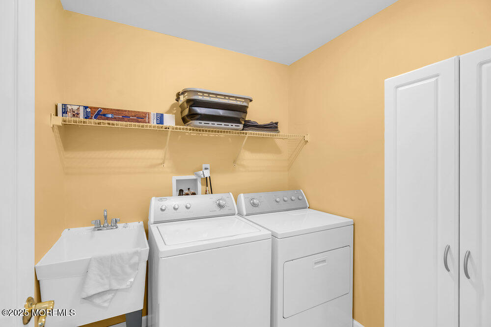 419 Central Avenue Spring Lake, NJ 07762 - Photo 29 of 41 a utility room with dryer and washer