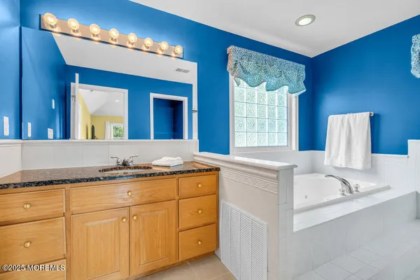 a bathroom with a bathtub and a toilet