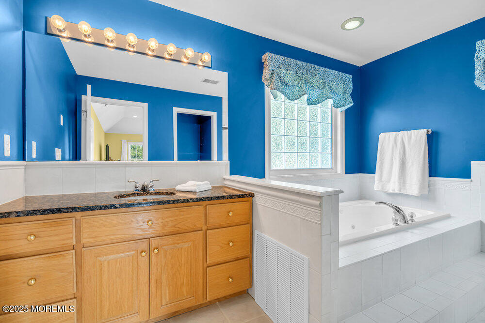 419 Central Avenue Spring Lake, NJ 07762 - Photo 35 of 41 a bathroom with a sink and a mirror