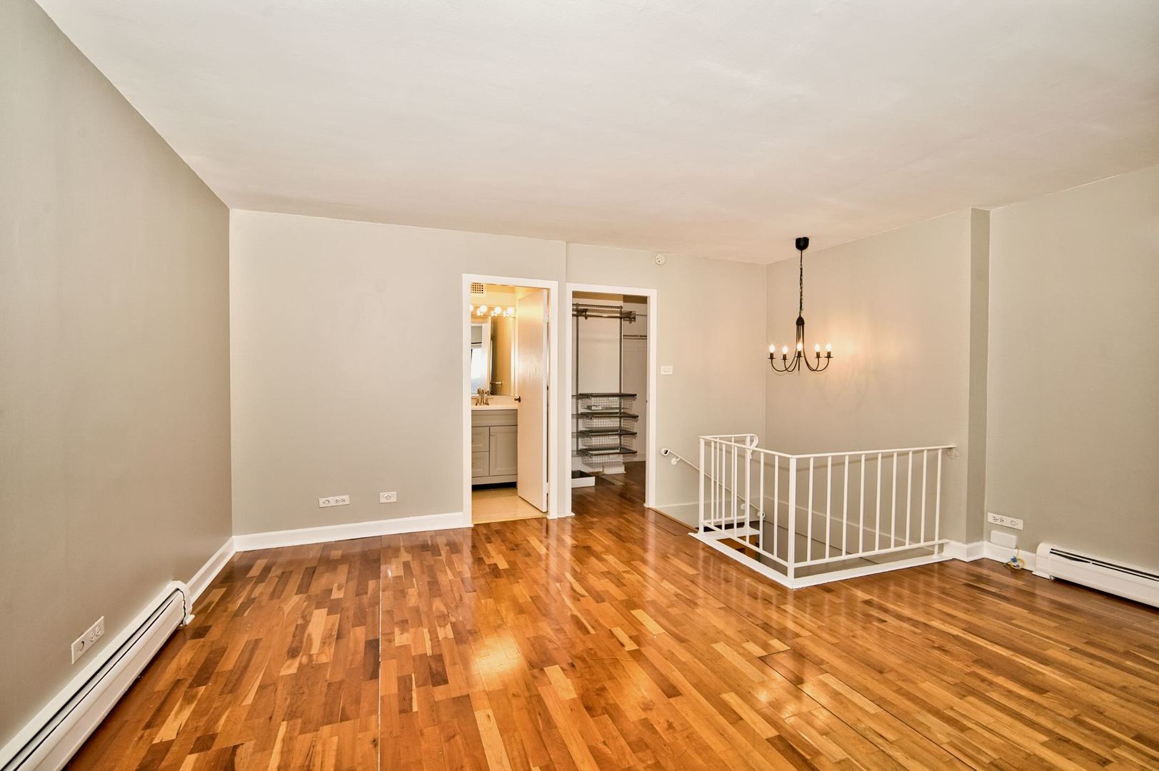 6166 North Sheridan Road, Unit 26A Chicago, IL 60660 - Photo 20 of 27 a view of an empty room with wooden floor