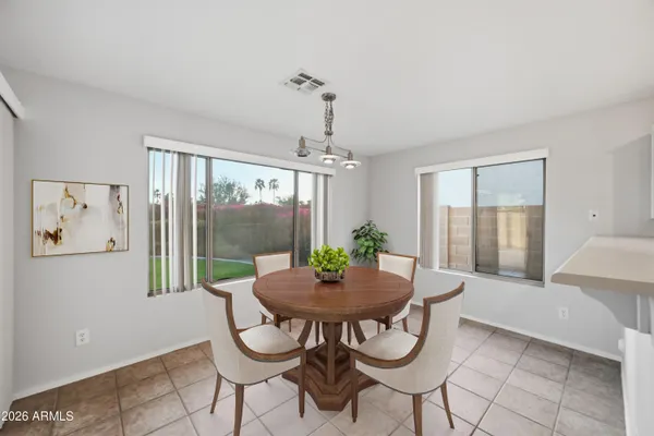 a view of a dining room with furniture window and outside view