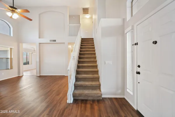 a view of an entryway with wooden floor