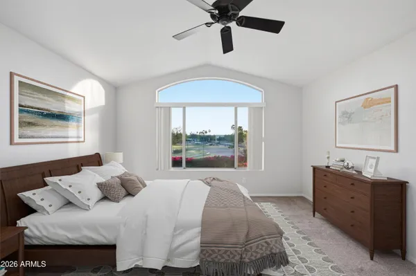 a bedroom with a bed and a window