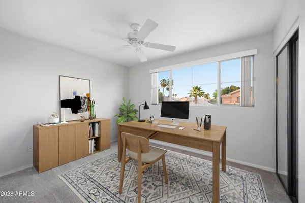 a workspace with furniture and window