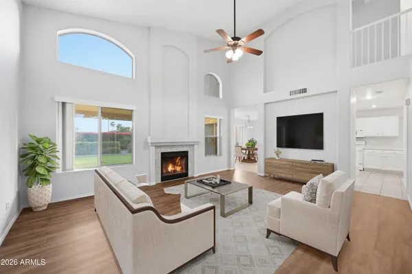 a living room with furniture and a fireplace
