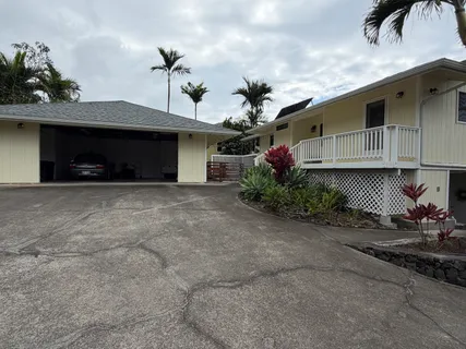 a view of a wooden deck with furniture
