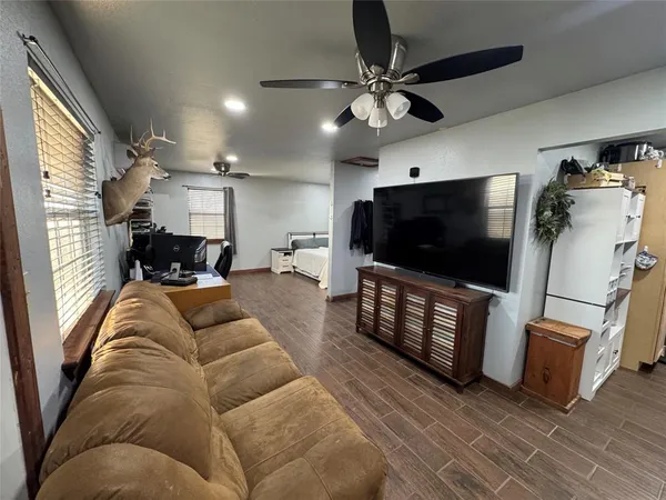 a kitchen with refrigerator and cabinets
