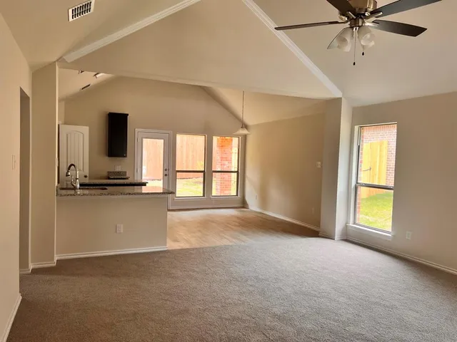 a view of an empty room with a window