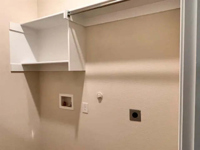 a view of a closet area with empty room