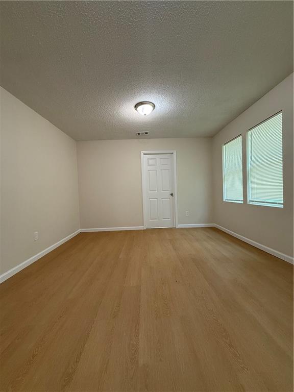 3319 Decatur Street Columbus, GA 31906 - Photo 5 of 18 an empty room with a empty space and windows