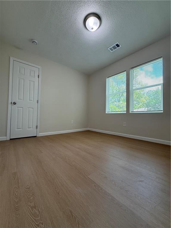 3319 Decatur Street Columbus, GA 31906 - Photo 9 of 18 an empty room with a empty space and windows