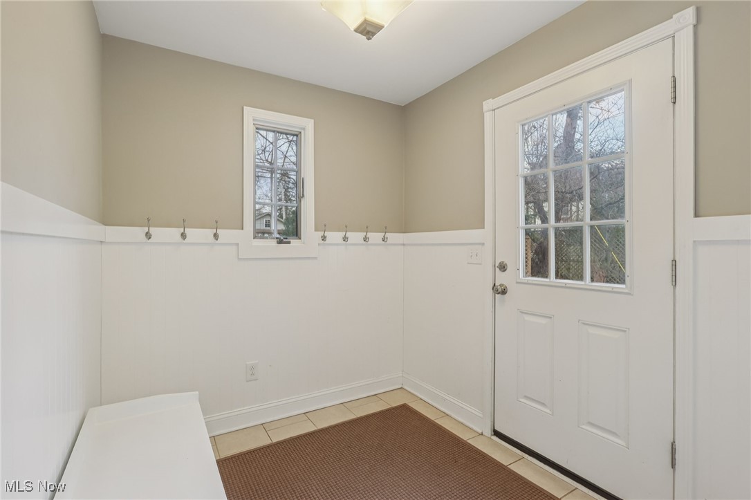 17024 Fernway Road Cleveland, OH 44120 - Photo 22 of 46 Mud Room with wainscoting and tile flooring and back entrance