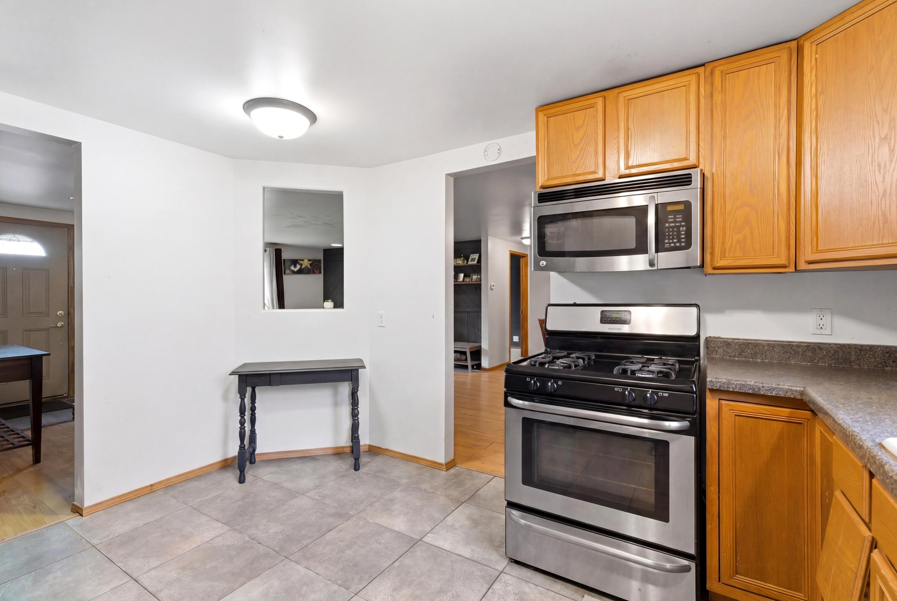 17333 North 700th Street West Hebron, IN 46341 - Photo 13 of 35 a kitchen with granite countertop cabinets stainless steel appliances and a counter space
