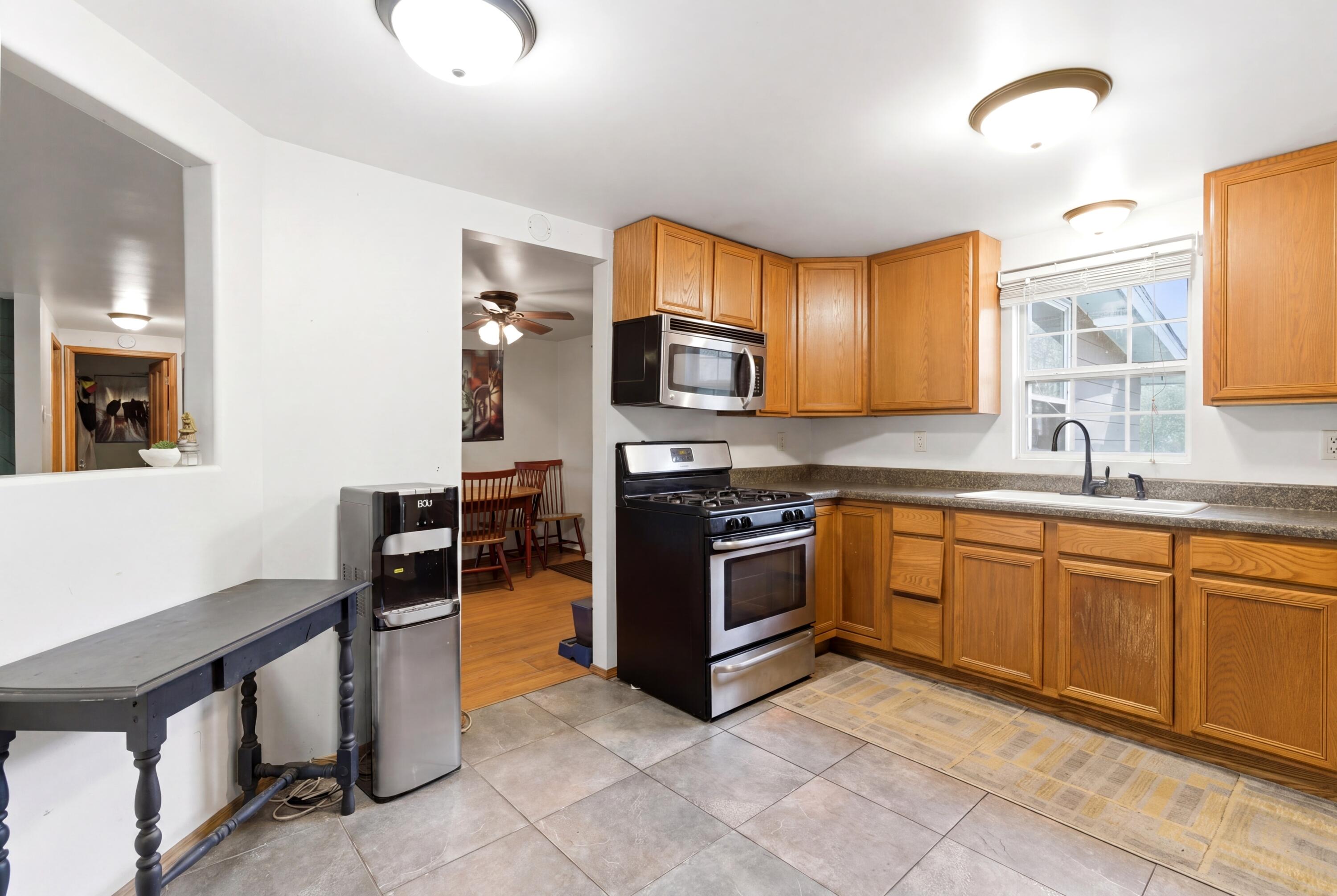 17333 North 700th Street West Hebron, IN 46341 - Photo 15 of 35 a kitchen with stainless steel appliances granite countertop a stove microwave and sink