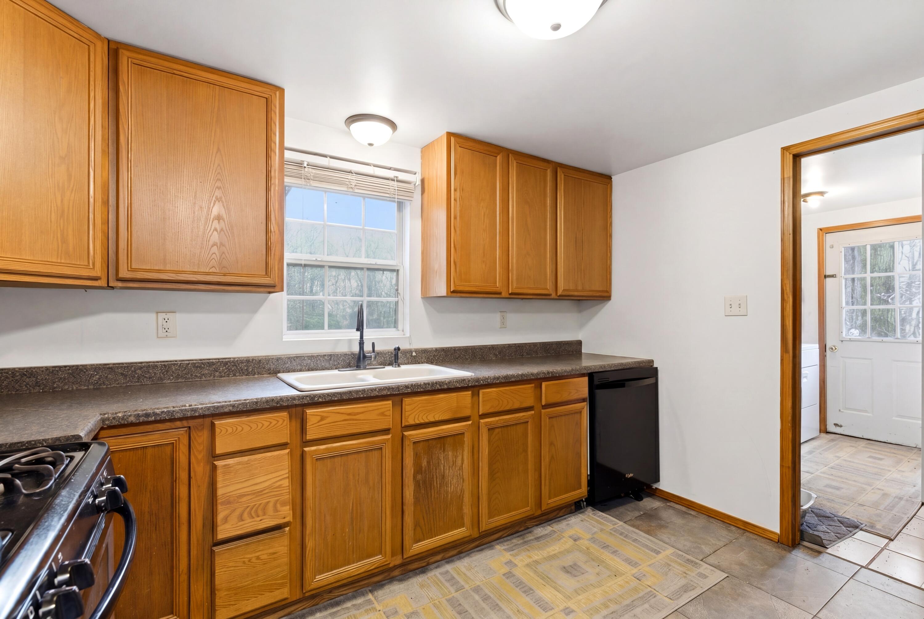 17333 North 700th Street West Hebron, IN 46341 - Photo 16 of 35 a kitchen with stainless steel appliances granite countertop a sink and cabinets