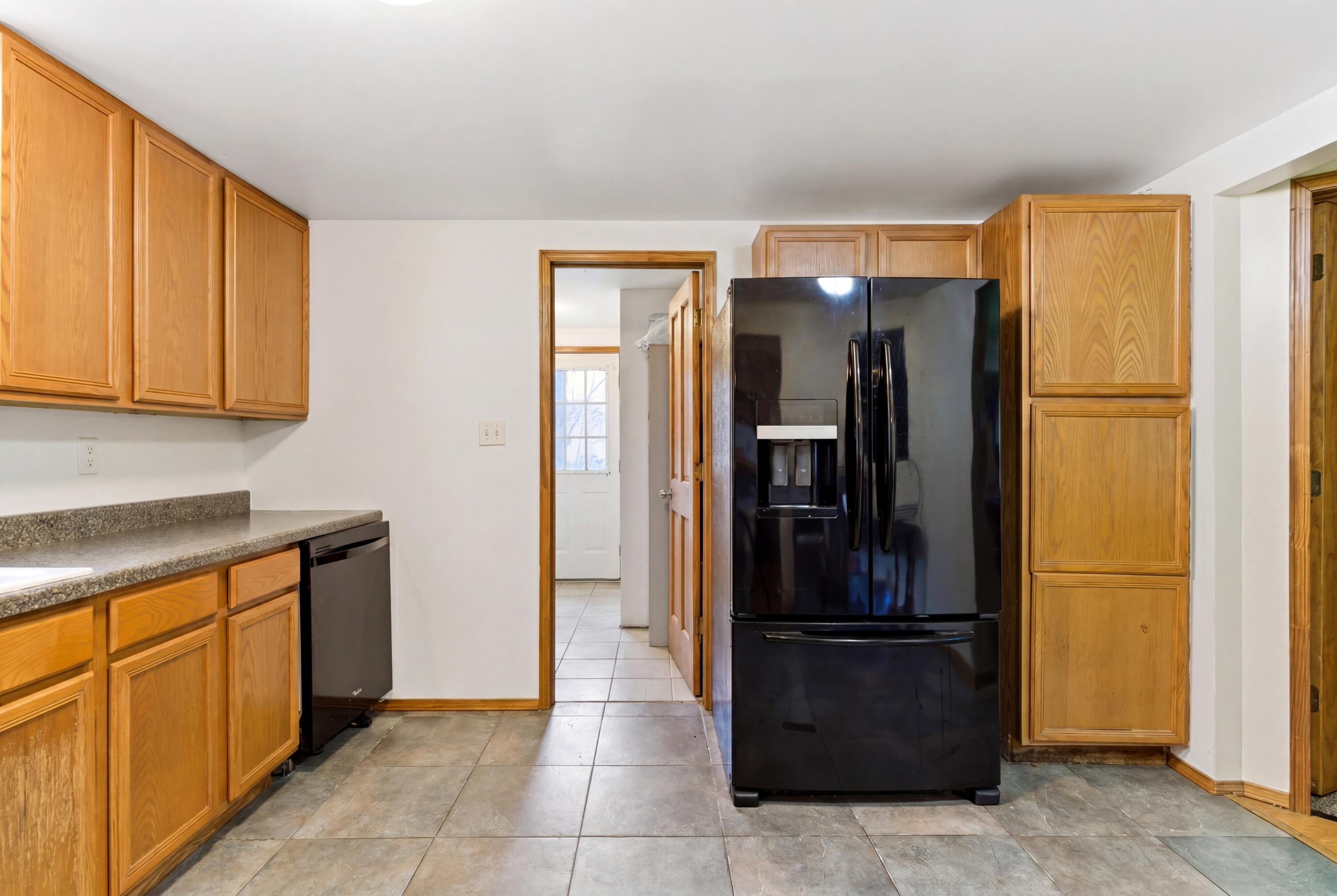 17333 North 700th Street West Hebron, IN 46341 - Photo 17 of 35 a kitchen with stainless steel appliances granite countertop a refrigerator and a sink