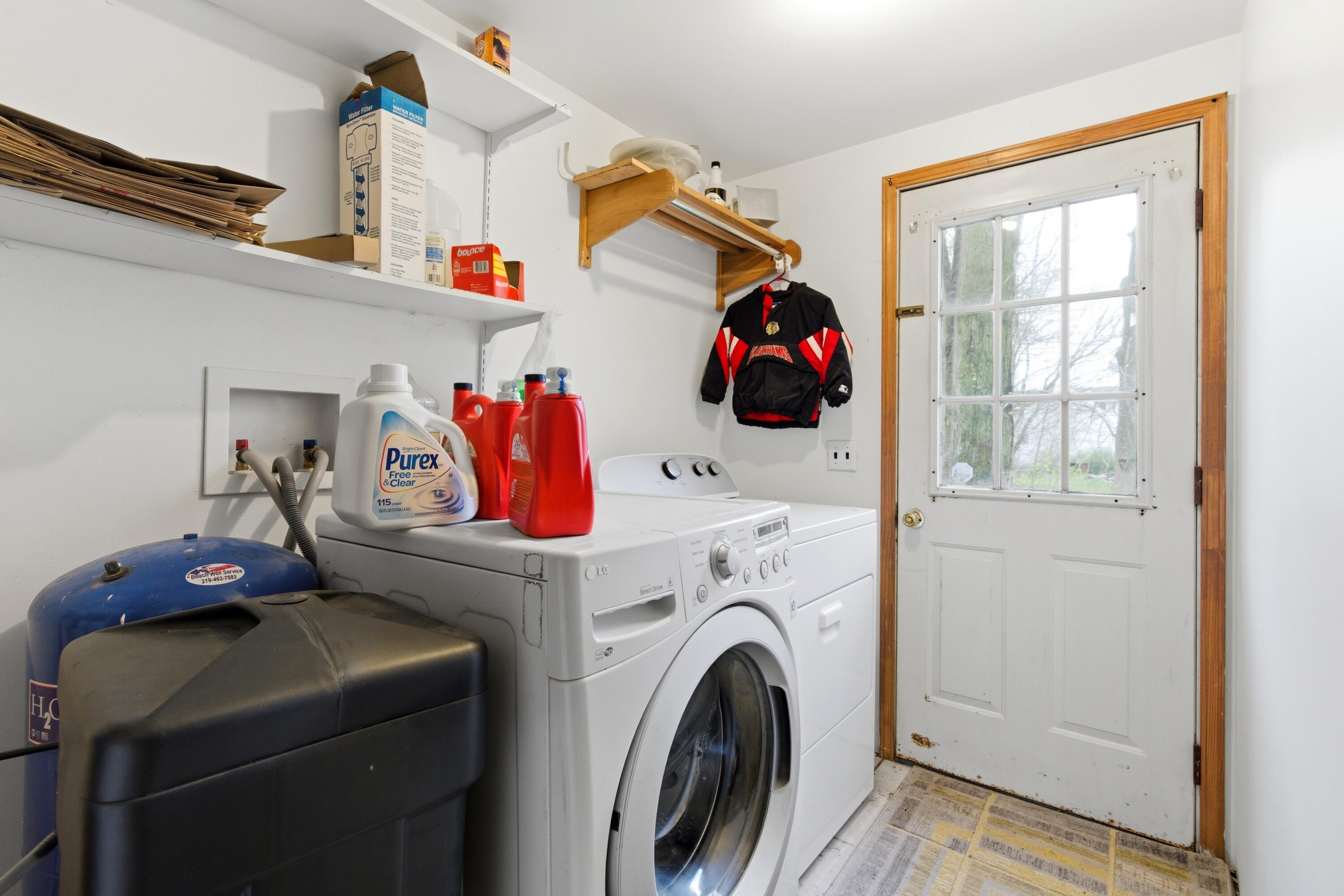 17333 North 700th Street West Hebron, IN 46341 - Photo 21 of 35 a utility room with dryer washer and shoe rack