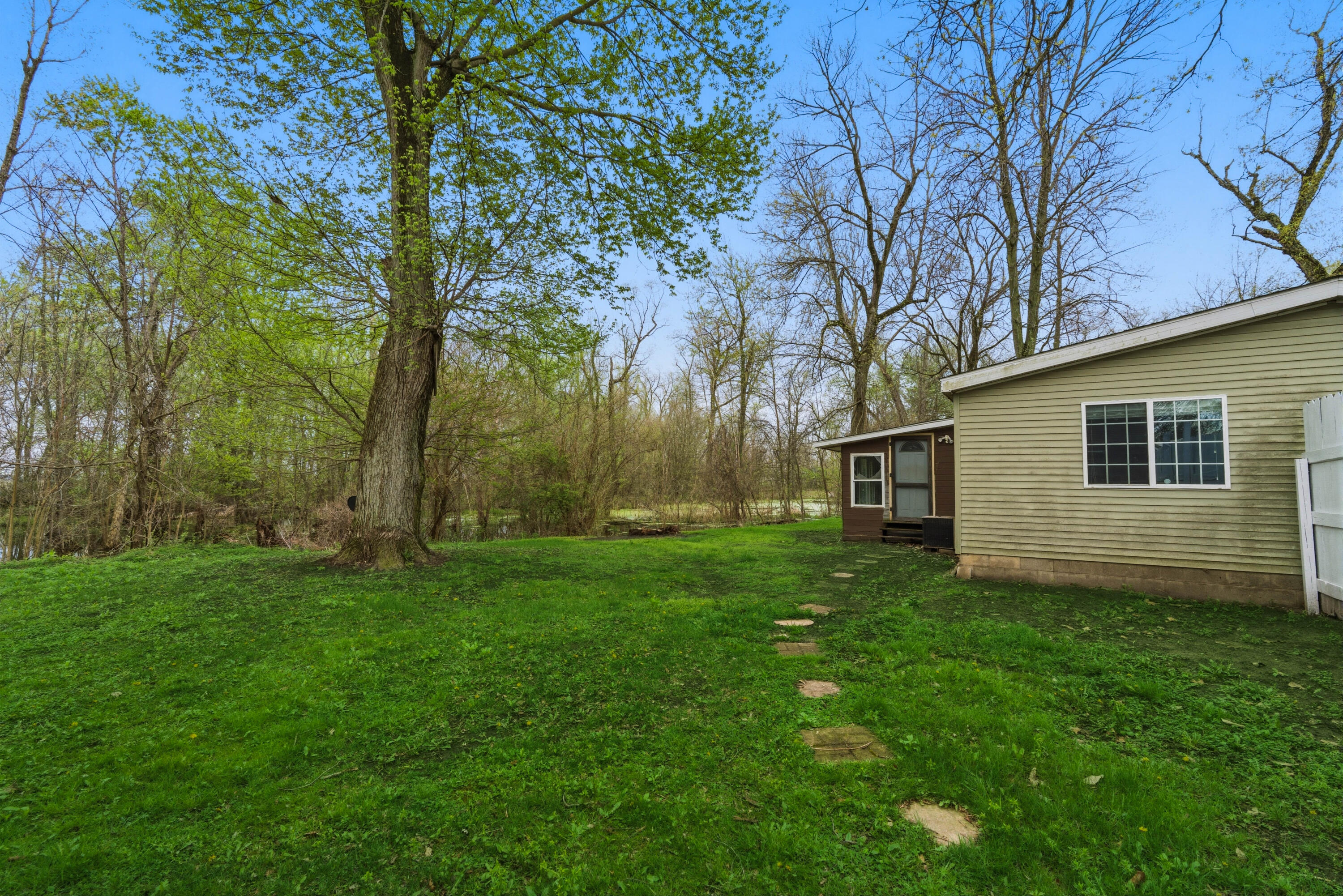 17333 North 700th Street West Hebron, IN 46341 - Photo 30 of 35 a view of a backyard with a large tree