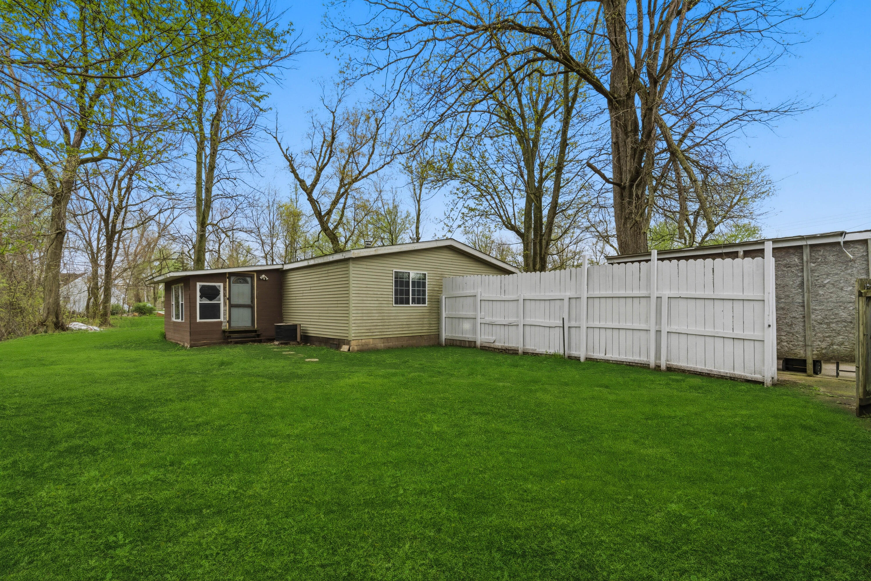 17333 North 700th Street West Hebron, IN 46341 - Photo 31 of 35 a view of a backyard with potted plants and large trees