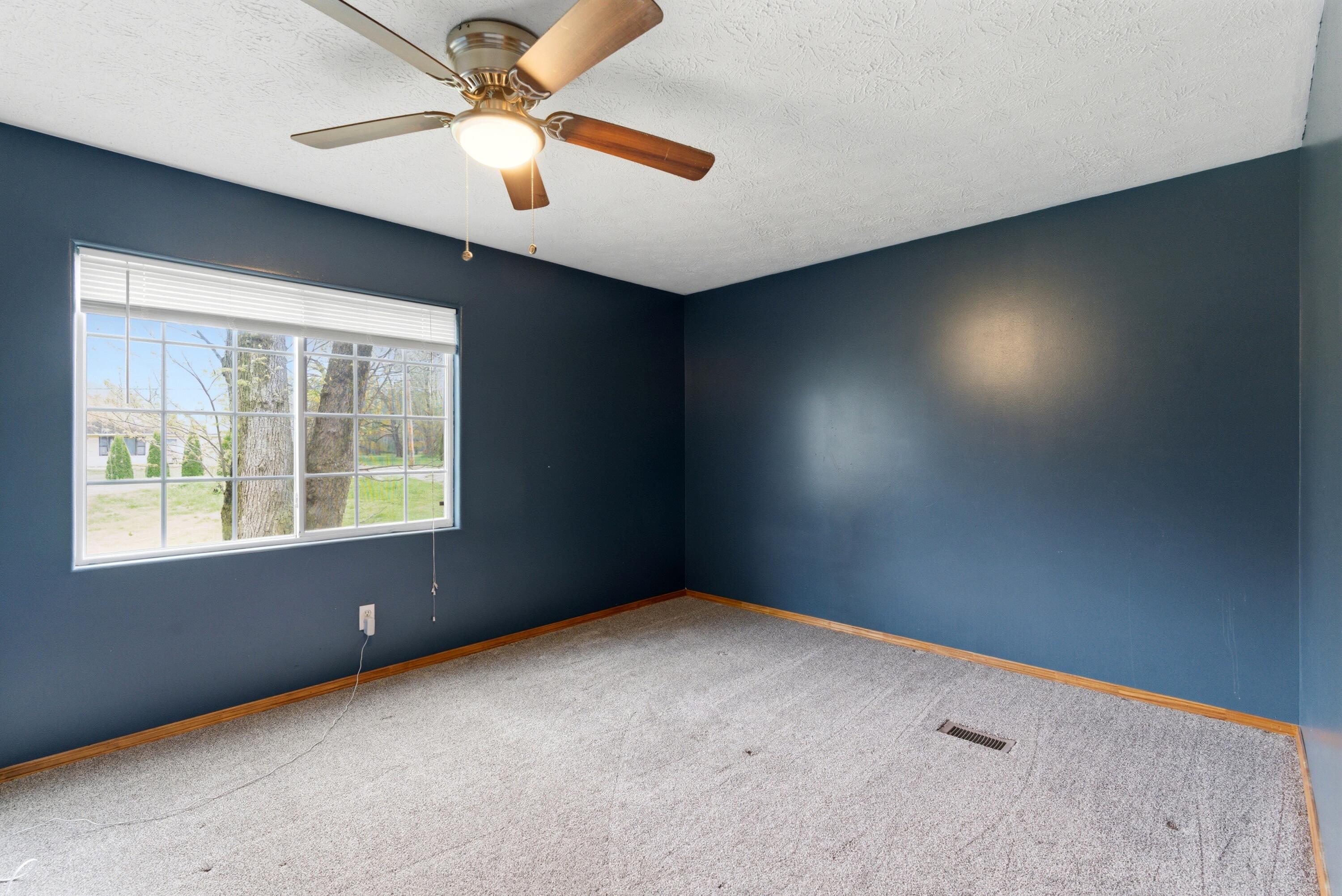 17333 North 700th Street West Hebron, IN 46341 - Photo 7 of 35 an empty room with a window and a fan