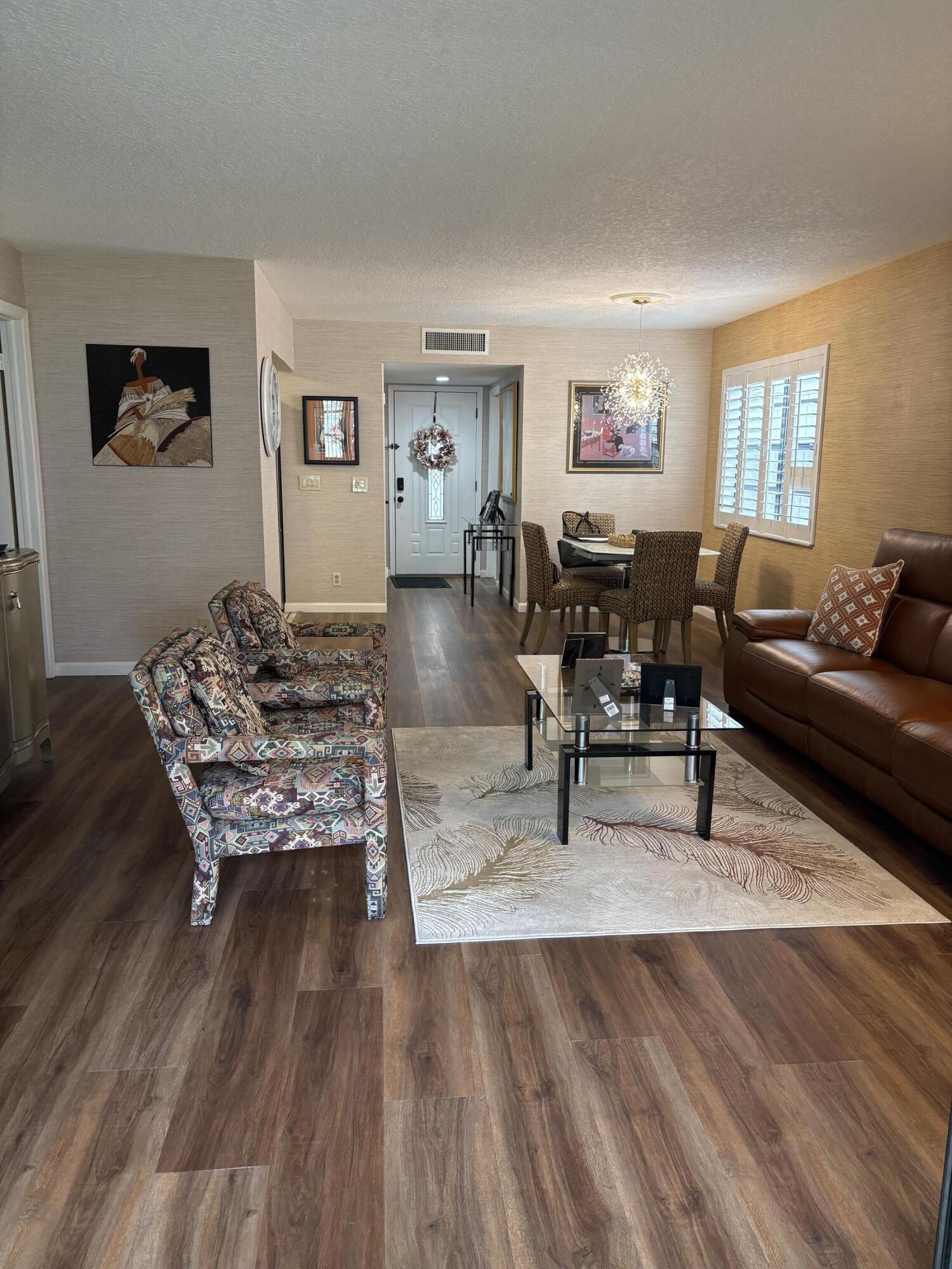 157 Capri East Delray Beach, FL 33484 - Photo 11 of 20 a living room with furniture and wooden floor