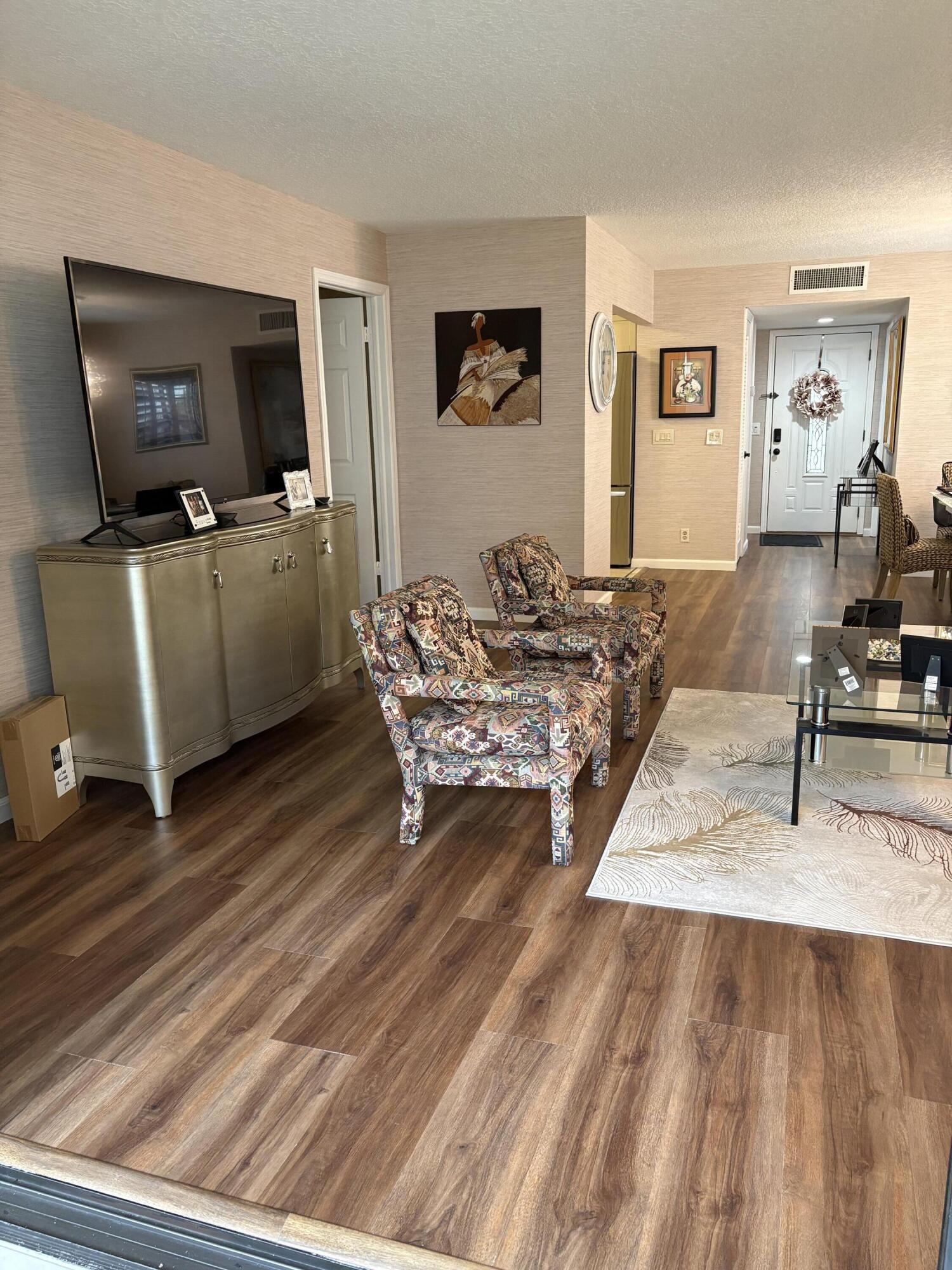 157 Capri East Delray Beach, FL 33484 - Photo 12 of 20 a living room with furniture and a flat screen tv
