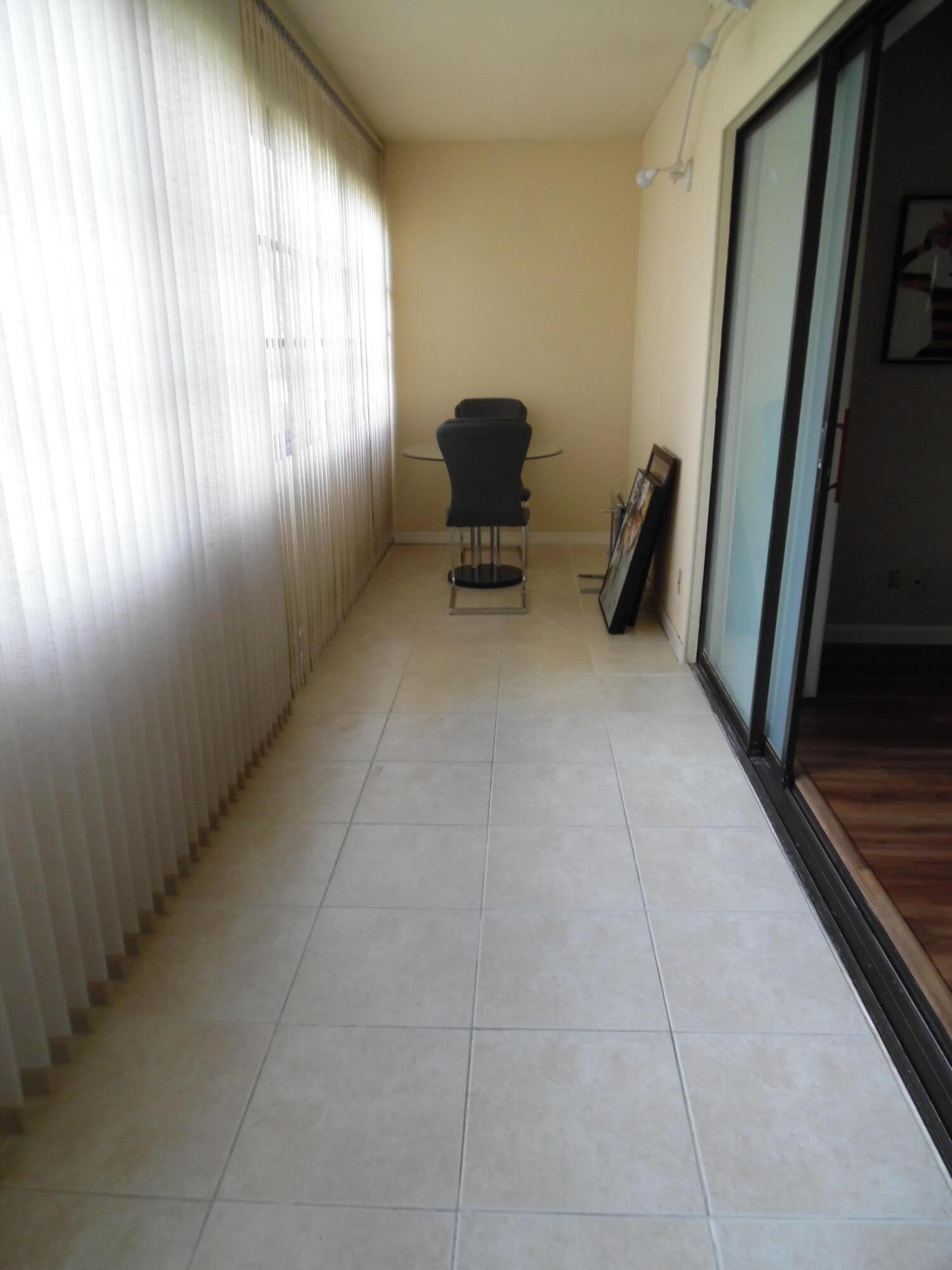 157 Capri East Delray Beach, FL 33484 - Photo 16 of 20 a view of a livingroom with furniture and a window