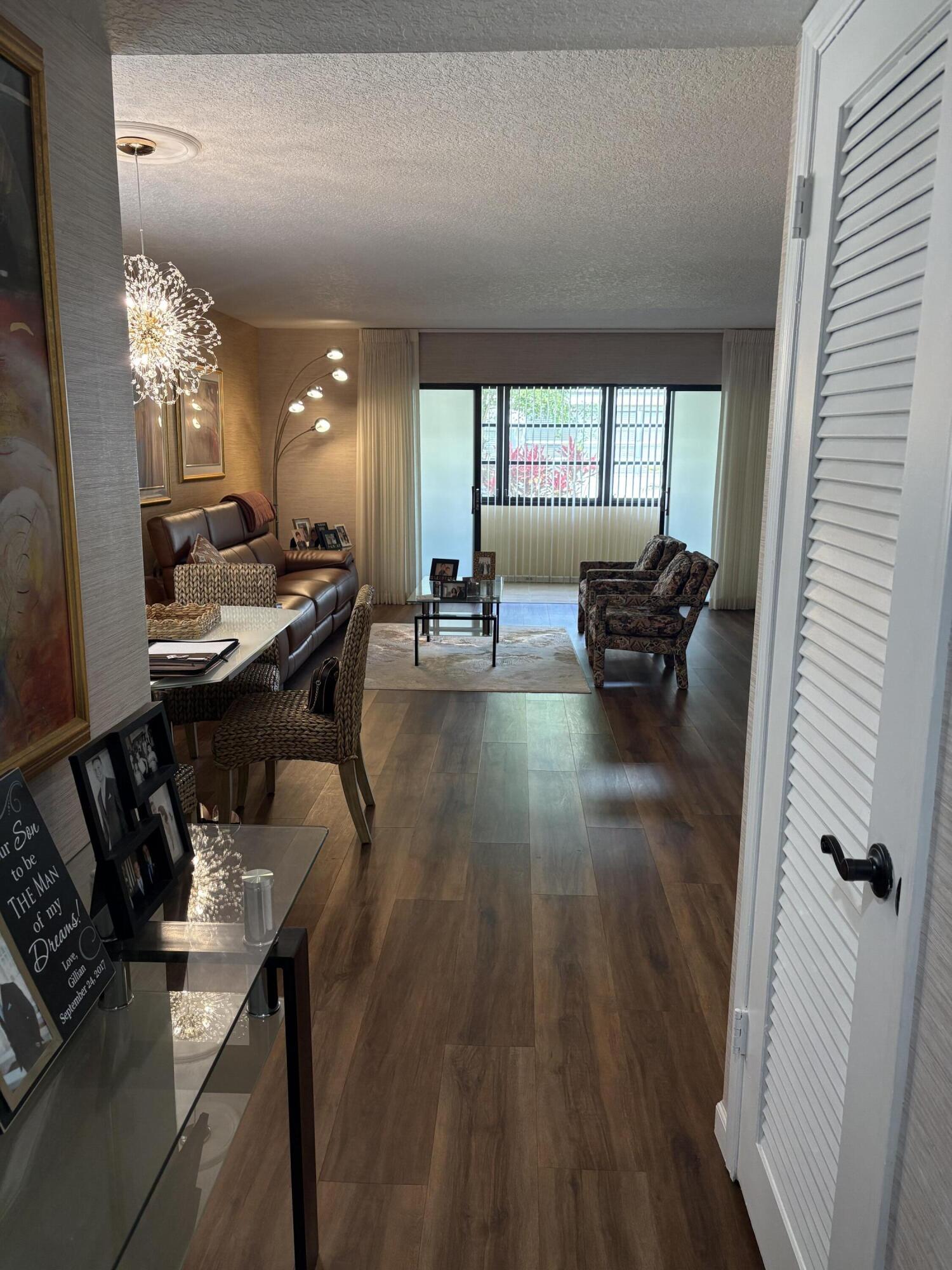 157 Capri East Delray Beach, FL 33484 - Photo 3 of 20 a living room with furniture and wooden floor