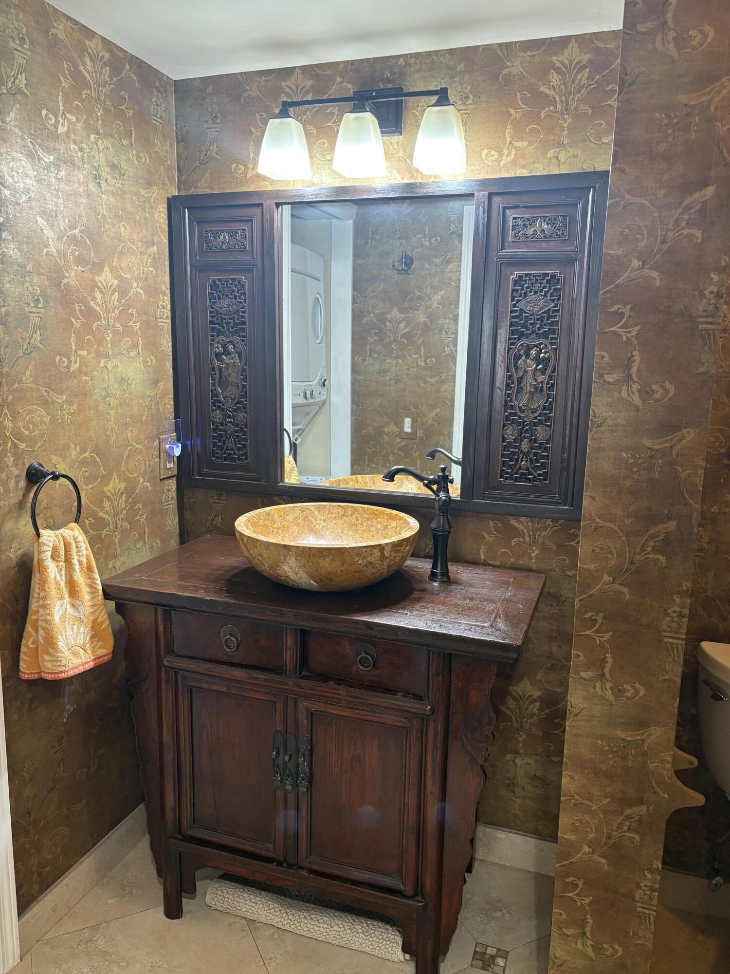 157 Capri East Delray Beach, FL 33484 - Photo 5 of 20 a bathroom with a sink a toilet and shower