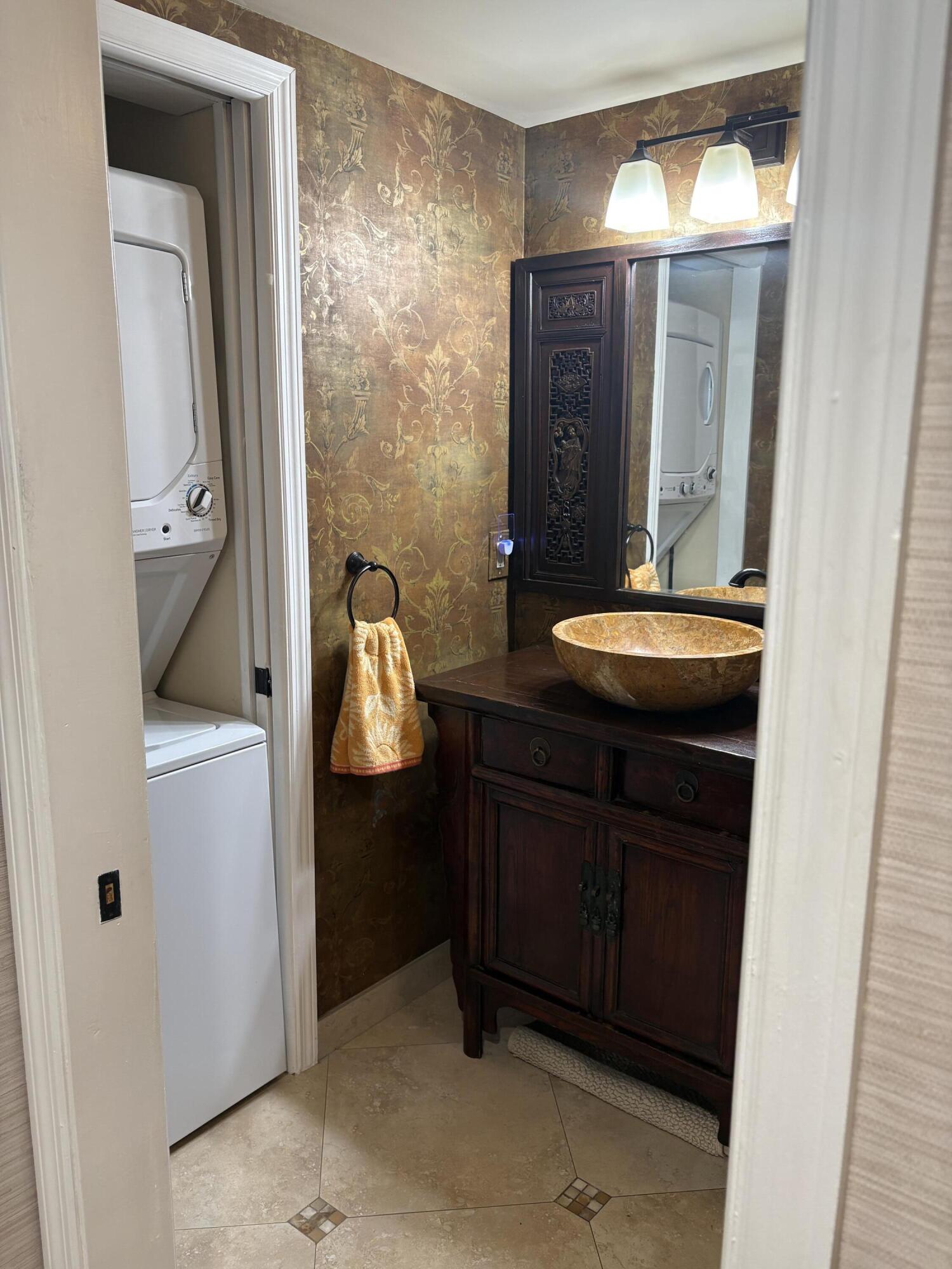 157 Capri East Delray Beach, FL 33484 - Photo 7 of 20 a bathroom with a sink and mirror