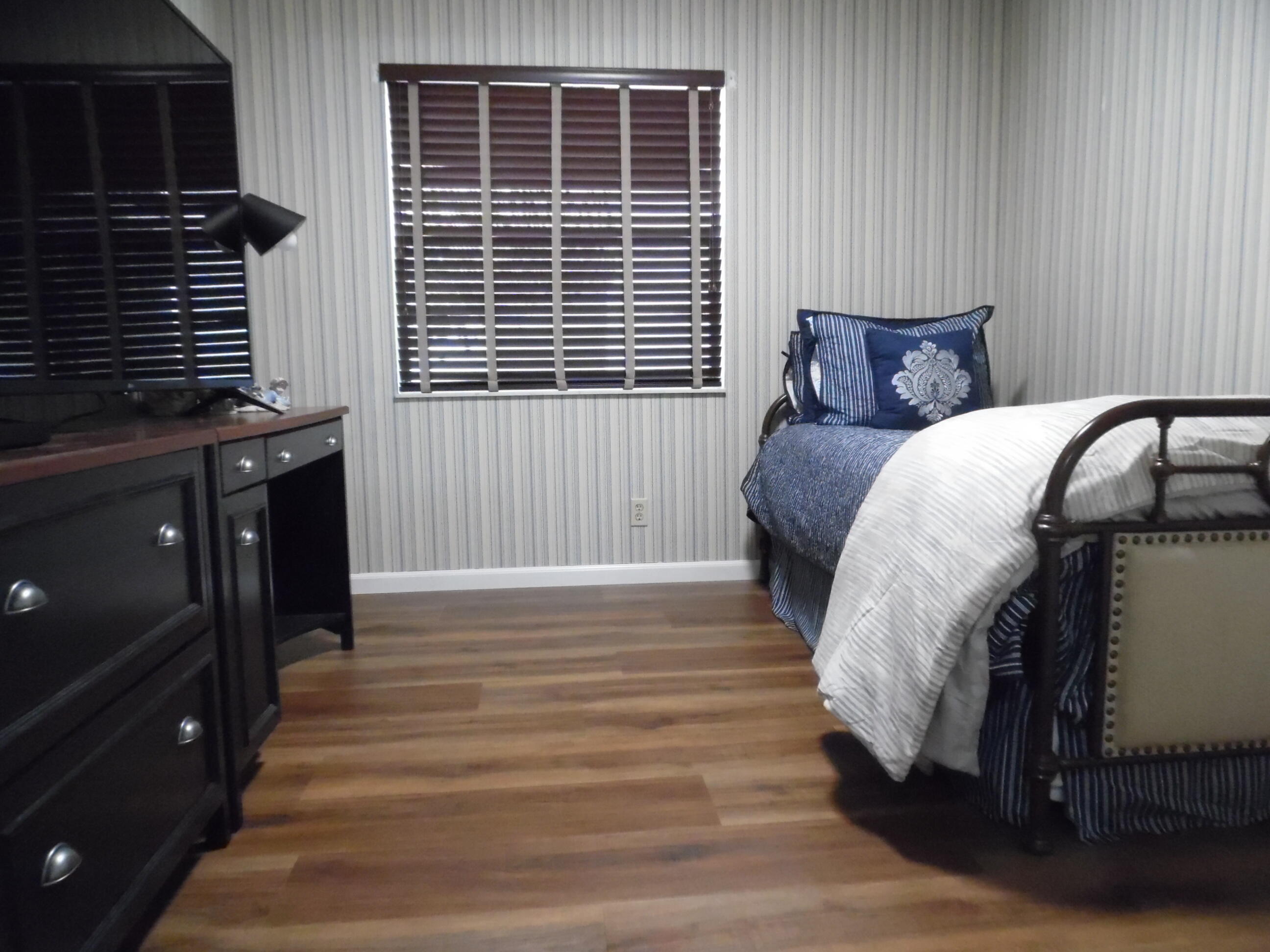 157 Capri East Delray Beach, FL 33484 - Photo 9 of 20 a bedroom with a bed and a window