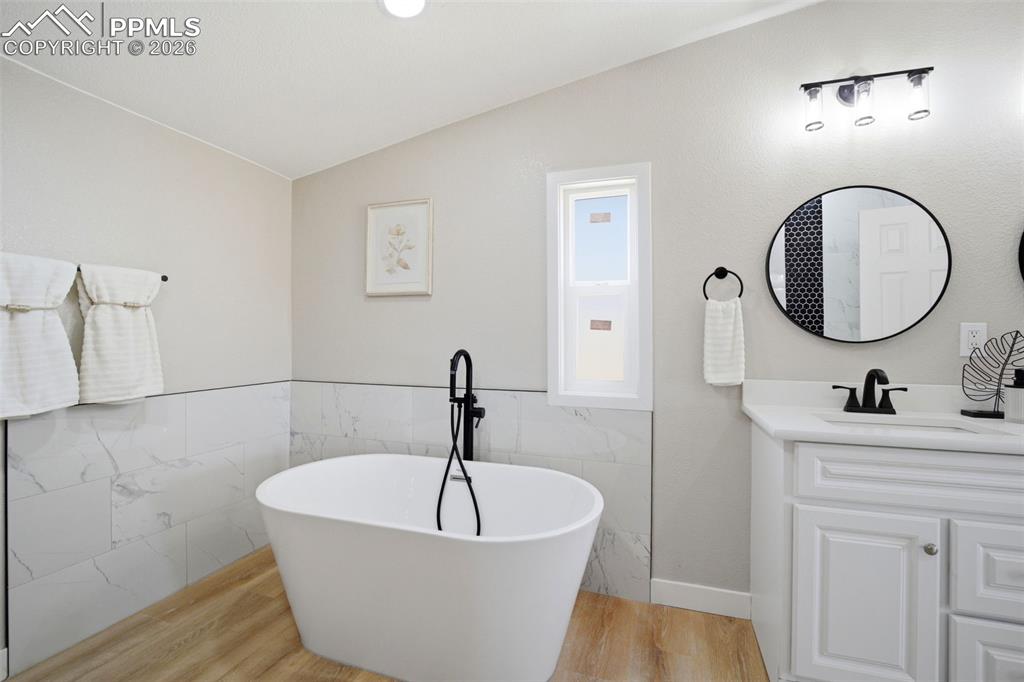 35125 Book Road Yoder, CO 80864 - Photo 15 of 45 a bath room with a sink and a mirror