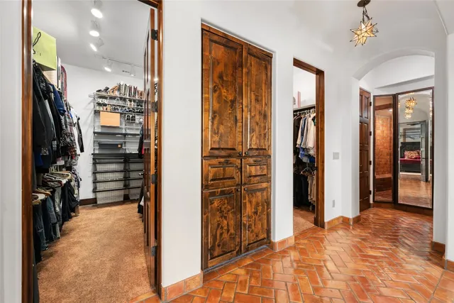 a large bathroom with a large tub and sink