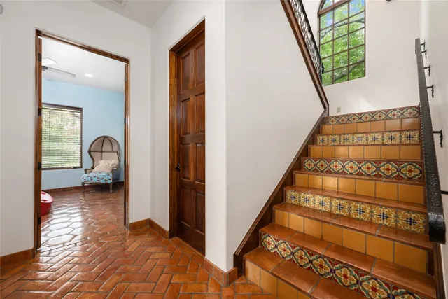 an empty room with closet and windows