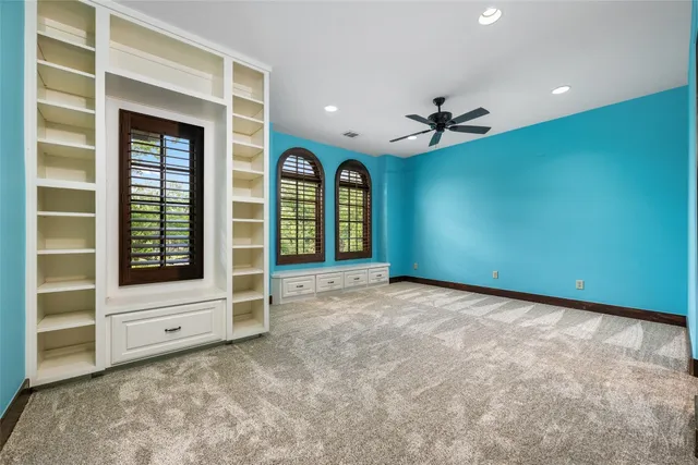 a bed room with a bed and a window