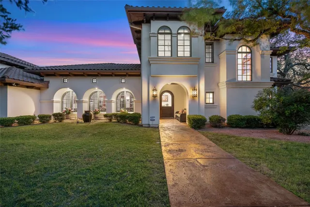 a living room with furniture a floor to ceiling window and a fireplace