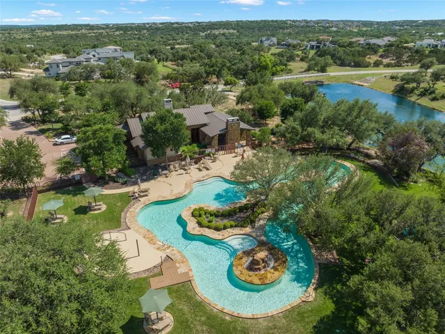 a view of a lake with houses in the back